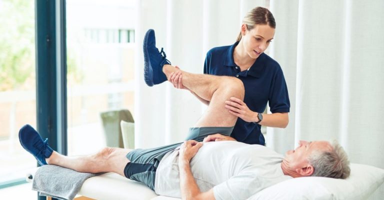 Physiotherapy doctor, senior patient and leg surgery, physical therapy and orthopedic healing. Physiotherapist, chiropractor and nurse help elderly injury, osteoporosis and arthritis rehabilitation